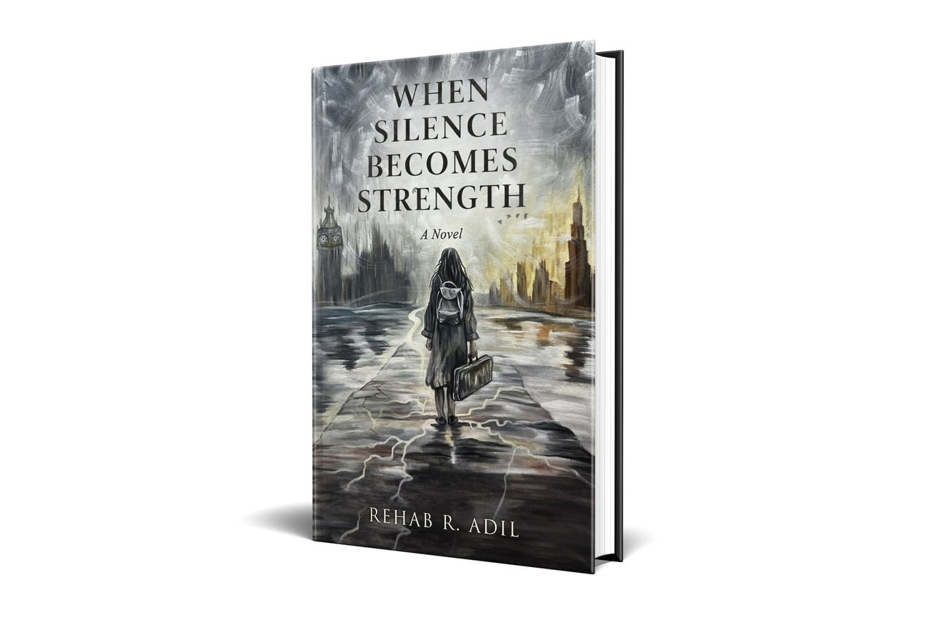 The hardback edition of When Silence Becomes Strength by Rehab R. Adil, standing upright.